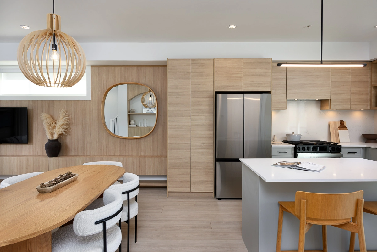 Plan A – kitchen and dining toward feature wall with mirror and television
