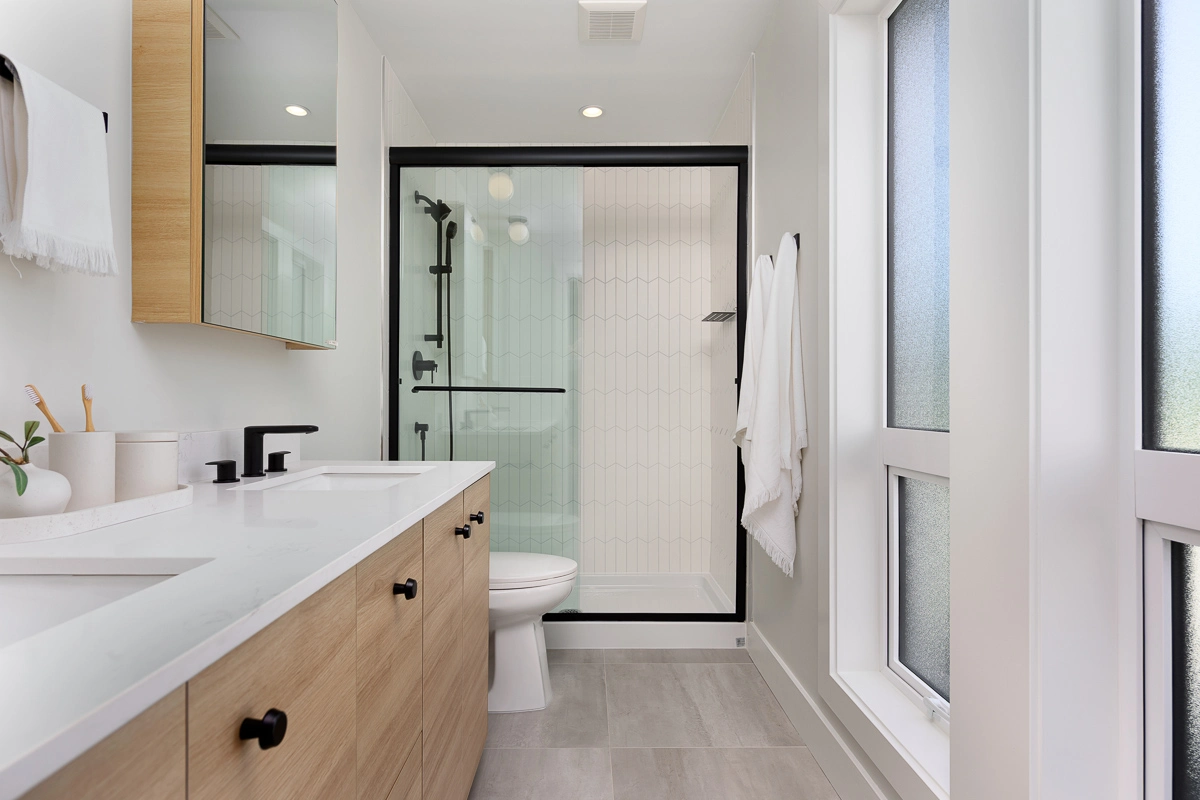 Plan A – ensuite bathroom with oak vanity, black fixtures and tiled shower